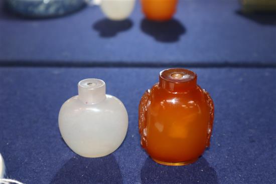 A Chinese agate snuff bottle and an amber glass snuff bottle